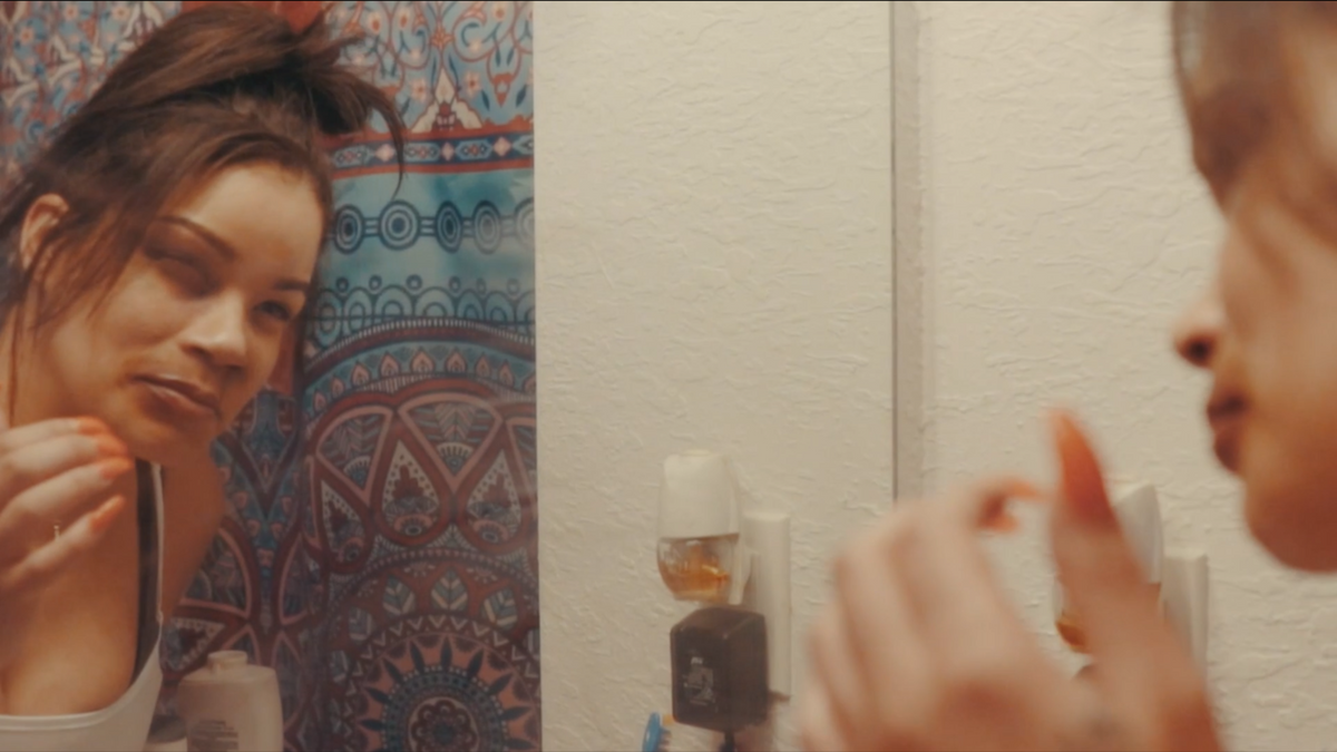 SMILE music video still - mirror scene