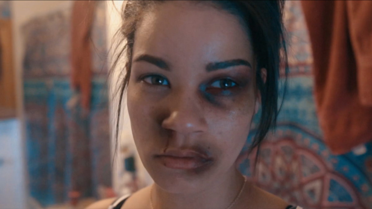 SMILE music video still - dramatic close-up